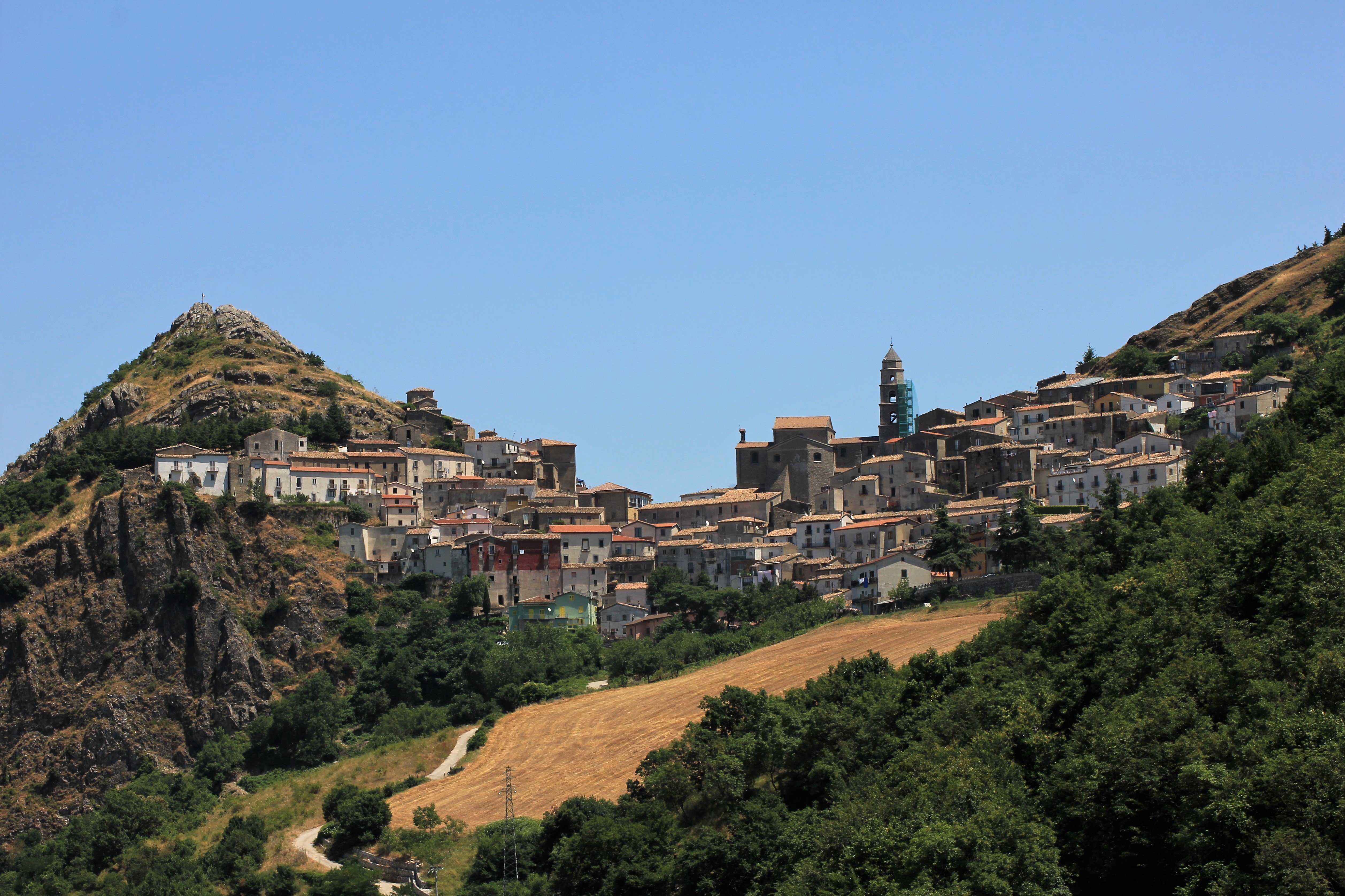 Stone houses and terracotta roofs of San Fele on a mountain saddle